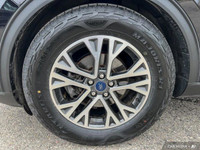 This Ford Escape boasts a Intercooled Turbo Premium Unleaded I-3 1.5 L/91 engine powering this Autom... (image 7)