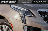 The 2023 Cadillac XT5 FWD Luxury in an elegant tan hue with its nimble front-wheel drive is all abou... (image 1)
