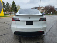 This stunning TESLA MODEL Y WITH UPGRADED LUXURIOUS Pearl White Exterior paint option with the stunn... (image 5)