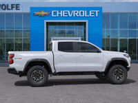 The 2025 Chevrolet Colorado ZR2, presented in Summit White with a Jet Black/Artemis interior, is eng... (image 9)