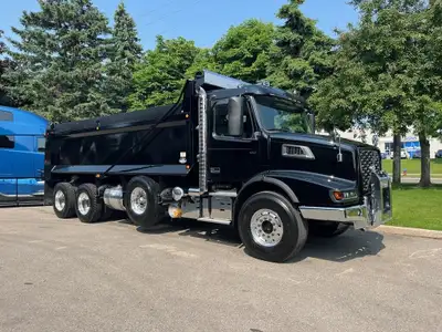 NEW VOLVO VHD84B dump truck in Black with matching Bibeau 21' x 48'' x 60'' black dump body. . Vehic...
