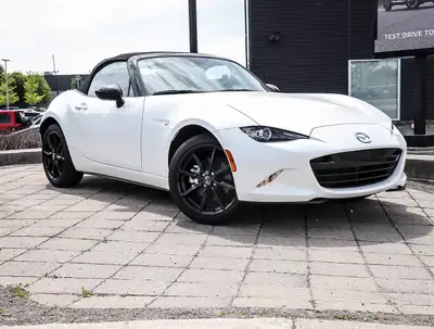Experience the pure thrill of driving with the 2019 Mazda MX-5 GS, a stunning white convertible with...