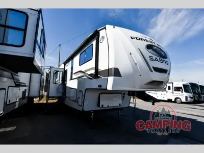 Forest River Sabre fifth wheel 36ML highlights: Rear Deck Two Power Awnings Fireplace Camper King Be...