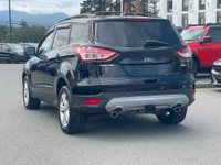 This 2019 Ford Escape SE has a Tuxedo Black exterior and Charcoal Black seats with seating for 5. Eq... (image 4)