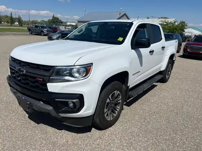 The 2022 Chevrolet Colorado 4WD Z71, in a classic white exterior with a steadfast 4×4 drivetrain, of...