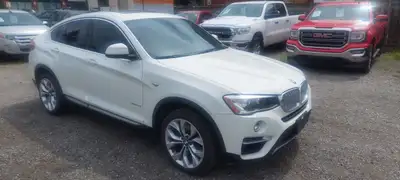 2017 BMW X4 xDrive28i -One Owner- Offer finished in a white exterior with a brown leather interior....