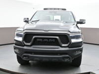 The 2021 Ram 1500 Rebel is a bold, off-road-focused full-size truck with a 5.7L HEMI V8 producing 39... (image 1)