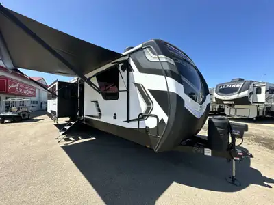 This couples travel trailer has it all. The larger master bedroom slide, the outside kitchen and the...