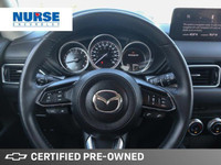 This 2022 Mazda CX-5 GS SUV boasts a sleek blue exterior and a sophisticated black leatherette inter... (image 9)