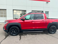 Our 2023 Honda Ridgeline Touring in Radiant Red Metallic is a local lease return! Call to book an ap... (image 1)