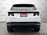 This 2022 Hyundai Tucson Essential SUV boasts a stunning Crystal White exterior and a sleek black cl... (image 5)