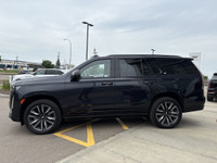 The 2023 Cadillac Escalade Sport Platinum stands out in Galactic Grey Metallic with 22-inch 12-spoke... (image 4)