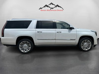 The 2016 Cadillac Escalade ESV Platinum in White combines robust 4×4 capabilities with luxurious dri... (image 5)