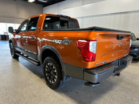 Take on your day in style with our 2019 Nissan Titan PRO-4X Crew Cab 4X4 shown off in Habanero Orang... (image 2)
