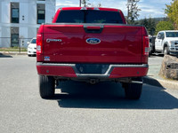 This 2015 Ford F-150 XLT has a Ruby Red Metallic exterior and Black Sport Interior with seating for... (image 5)