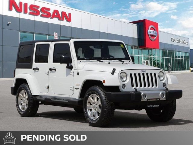 2014 Jeep Wrangler Unlimited Sahara in Cars & Trucks in London