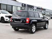 The 2015 Jeep Patriot North is a compact SUV known for its rugged off-road capability, stylish desig... (image 6)