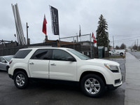 This 2014 GMC Acadia SLE-2 is a spacious and reliable SUV with a sleek white exterior and a comforta... (image 5)