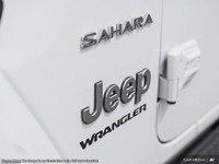 This Jeep Wrangler has a dependable Intercooled Turbo Premium Unleaded I-4 2.0 L/122 engine powering... (image 9)