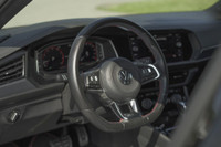 This 2021 Volkswagen Jetta GLI is a sleek sedan with a stylish black exterior and a sunroof for thos... (image 7)