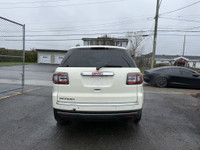 This 2014 GMC Acadia SLE-2 is a spacious and reliable SUV with a sleek white exterior and a comforta... (image 3)