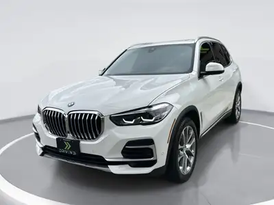 Meet the 2022 BMW X5 xDrive40i, a stunning white SUV equipped with the confidence of all-wheel drive...