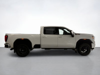 Drive our used Diesel powered 2021 GMC Sierra 2500 AT4 Crew Cab standard box 4X4 in Summit White and... (image 5)