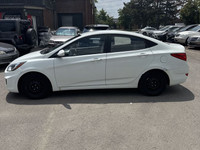 This 2014 Hyundai Accent Sedan is a reliable and stylish choice! With its sleek white exterior and c... (image 2)