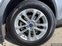 This Ford Escape has a strong Intercooled Turbo Regular Unleaded I-3 1.5 L/91 engine powering this A... (image 6)