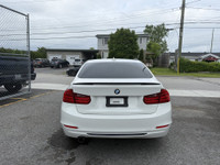 This 2014 BMW 320 is a sleek and reliable sedan that's sure to turn heads. With its stylish white ex... (image 6)