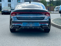 This 2021 Kia K5 GT-Line has a Grey Exterior and Black Interior with seating for 5. Equipped with a... (image 4)
