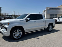 The Chevrolet Silverado 1500 High Country in pristine white with a robust 4×4 drivetrain ensures exc... (image 3)