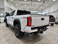 Adventure beckons with the brand-new 2025 Toyota Tacoma in a striking Brown hue, a robust addition t... (image 5)