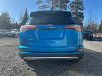 The 2017 Toyota RAV4 Hybrid XLE in a stunning blue finish offers exceptional control with its AWD dr... (image 3)