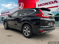 Command the road in this 2018 Honda CR-V EX-L, boasting a sleek Crystal Black Pearl exterior and a s... (image 3)