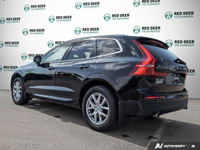 The 2021 Volvo XC60 T5 AWD Momentum is a sophisticated black SUV that offers an impeccable balance o... (image 4)