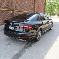 This 2019 Volkswagen Jetta is a stylish sedan with a sleek black exterior and dual tone black and pe... (image 5)