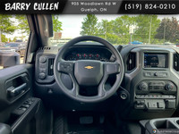 The 2025 Chevrolet Silverado 2500HD Custom in pristine white with a robust 44 drivetrain is designed... (image 9)