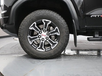 The AT4 trim features off-road suspension with skid plates, all-terrain tires, hill descent control,... (image 3)