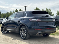 Under the glistening Rhapsody Blue exterior, the 2019 Lincoln Nautilus Reserve stands as a testament... (image 4)