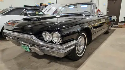 1965 Ford Thunderbird convertible. 390 V8 and an automatic, both recently rebuilt. Very neat the way...