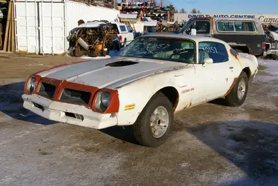 No motor or transmission, has 3.23 posi, power windows, door locks, tilt steering, power trunk, hone...