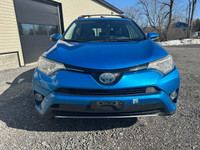 The 2017 Toyota RAV4 Hybrid XLE in a stunning blue finish offers exceptional control with its AWD dr... (image 7)