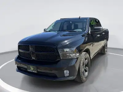 The Ram 1500 Classic Express in bold black is a robust 4x4 truck that combines reliability and rugge...