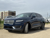 Under the glistening Rhapsody Blue exterior, the 2019 Lincoln Nautilus Reserve stands as a testament... (image 2)