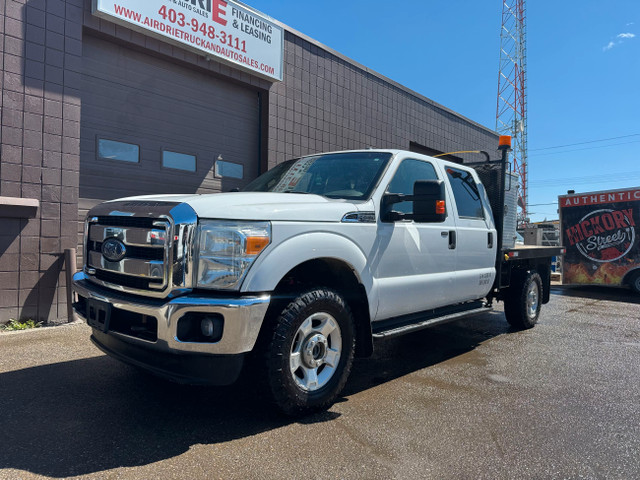 2013 Ford Super Duty F-350 SRW XLT FLAT DECK 4X4 in Cars & Trucks in Calgary - Image 2