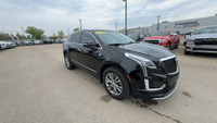 This Cadillac XT5 is equipped with: Leather Seating Surfaces w/Mini Perforated Inserts, Power moonro... (image 4)