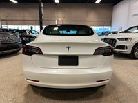Getting acquainted with our 2021 Tesla Model 3 Standard Range Plus Sedan in Pearl White Multi-Coat i... (image 3)