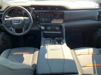 The 2025 GMC Sierra AT4 features a luxurious, athletic, and purposeful interior that is designed to... (image 9)