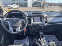 This 2021 Ford Ranger 4x4 Crew Cab, Velocity Blue with a sleek black interior, is ready for adventur... (image 9)